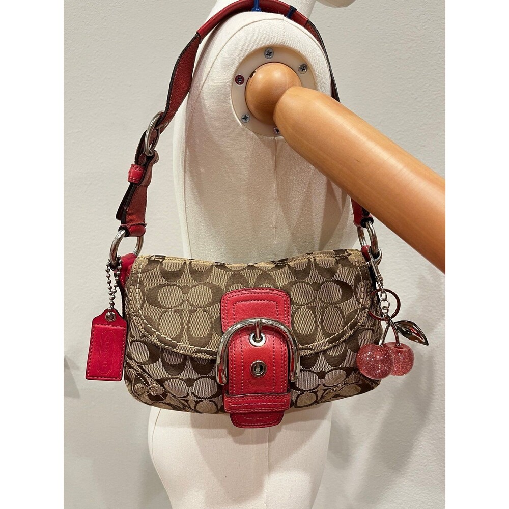 Coach Signature C and pink leather small sized Soho bag.